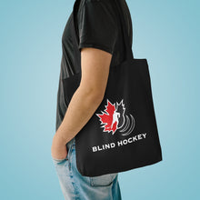 Load image into Gallery viewer, Individual with the Canadian blind hockey tote bag over their shoulder 

