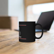 Load image into Gallery viewer, Black coffee mug with the Canadian Blind Hockey logo on the front the mug is infront of a laptop
