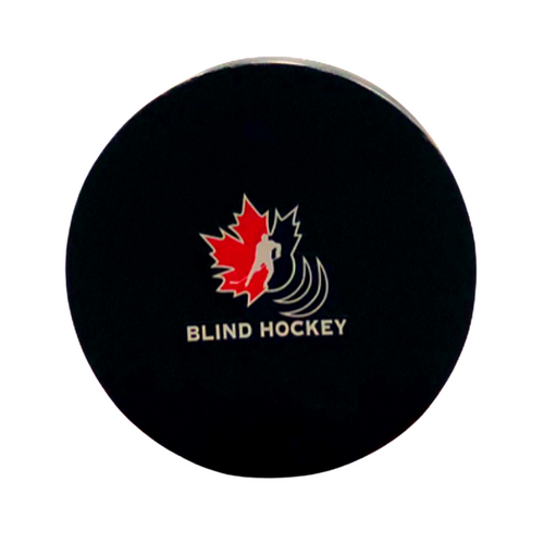 photo of a adaptive  blind hockey puck 
